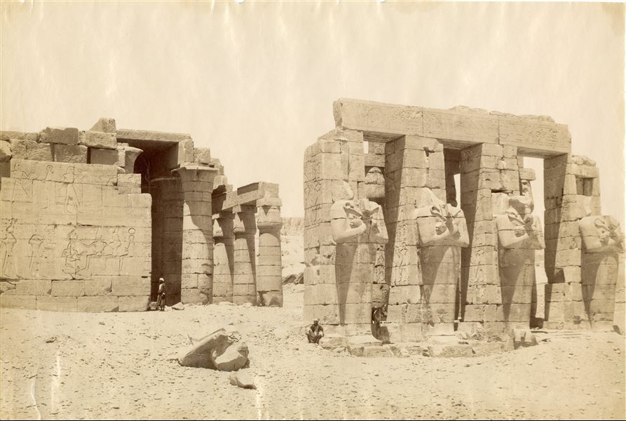 The photograph shows part of the second courtyard of the Ramesseum, where the monumental Osiride pillars of Pharaoh Ramesses II stand.