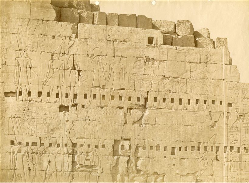 Detail of the inscriptions on the northern façade, east side, of the eighth pylon in the Karnak Temple Complex. The reliefs show pharaohs Tuthmosis I and Seti I (upper register), Tuthmosis II and Seti I (lower register) performing rituals and praying to the gods, including Amun. Queen Hatshepsut was depicted but then later replaced with the name of Tuthmosis II. 