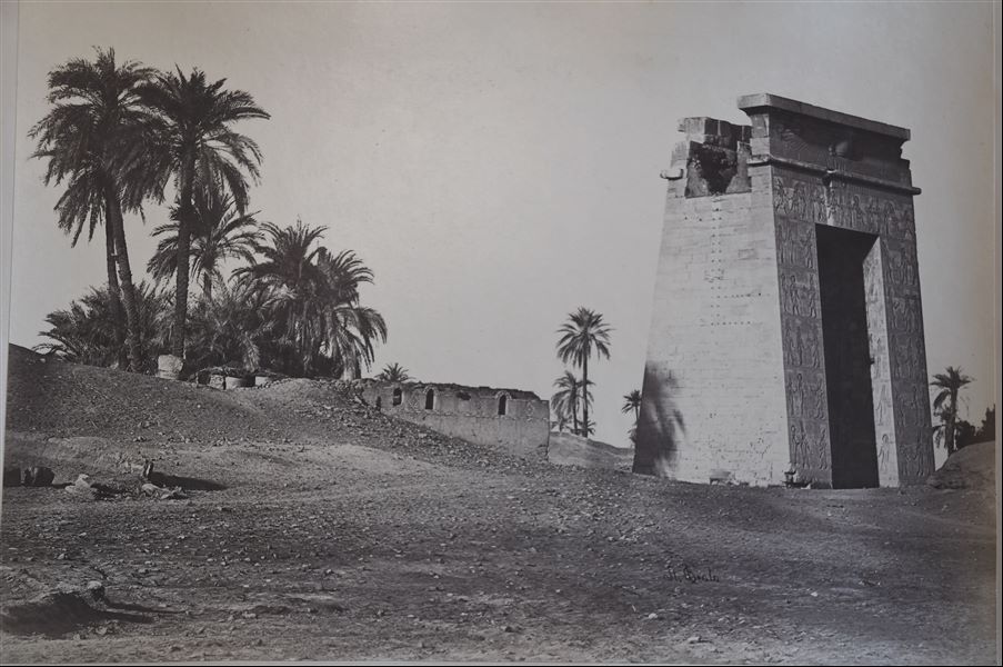 Photograph of the western gate of the Karnak Temple Complex, built by Ptolemy IV. The author's signature is at the bottom right. 