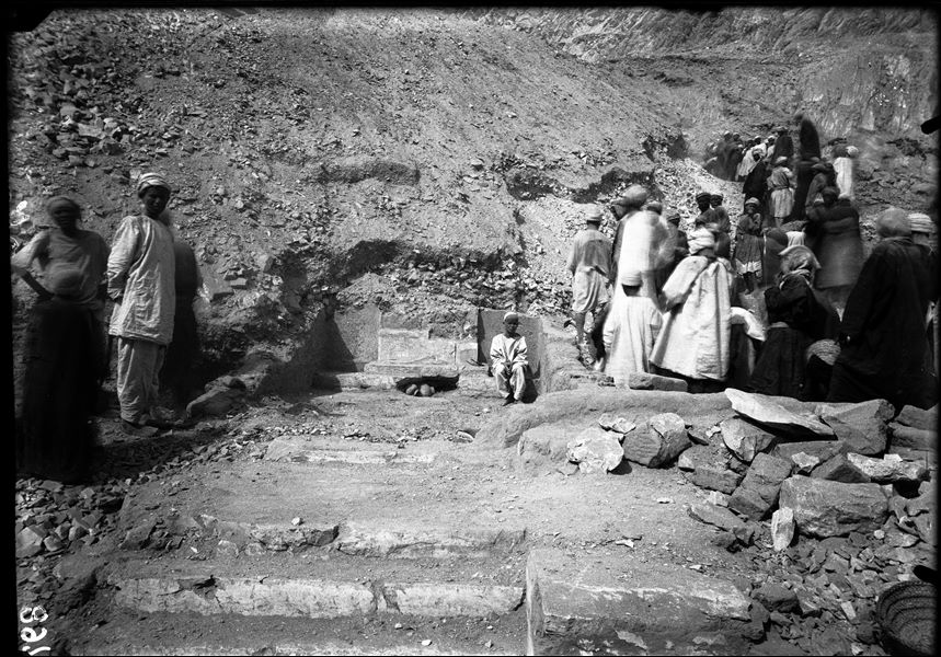 Excavations along the slope of the mountain, on the right side of the temple of the goddess Hathor. Relief from chapel G, with the cartouches of Seti II, inscribed over those of Amenmesse (S.06136). Schiaparelli excavations. 