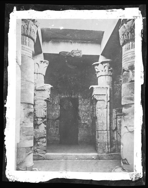 The small temple from the Ptolemaic period, built by Ptolemy IV, stands at the north-eastern end of the valley and was used as a dwelling in Christian times. The photograph shows the innermost part of the sanctuary, with a chamber at the back. Schiaparelli excavations.