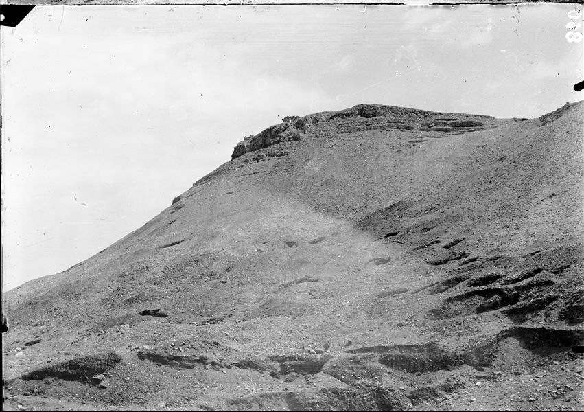 View of the top of the mountain, east of the village of Deir el Medina. In the foreground there are holes left by unauthorised excavations. Schiaparelli excavations. 