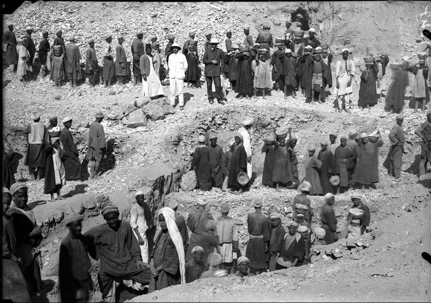 Excavations in the northern area of the necropolis, west of the temple of the goddess Hathor. The excavation reveals the terraces in front of the tomb entrances (which are not yet visible). In the centre of the photograph from the left: Bolos Ghattas, Arturo Frova and an Egyptian inspector. Schiaparelli excavations. 