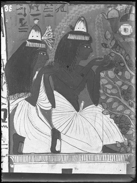 Ceiling detail, near the north wall from the tomb of Sennedjem (TT1). Sennedjem and his wife Iyneferti in the afterlife, resting on a mastaba-shrine and drinking water poured by the goddess Nut. 