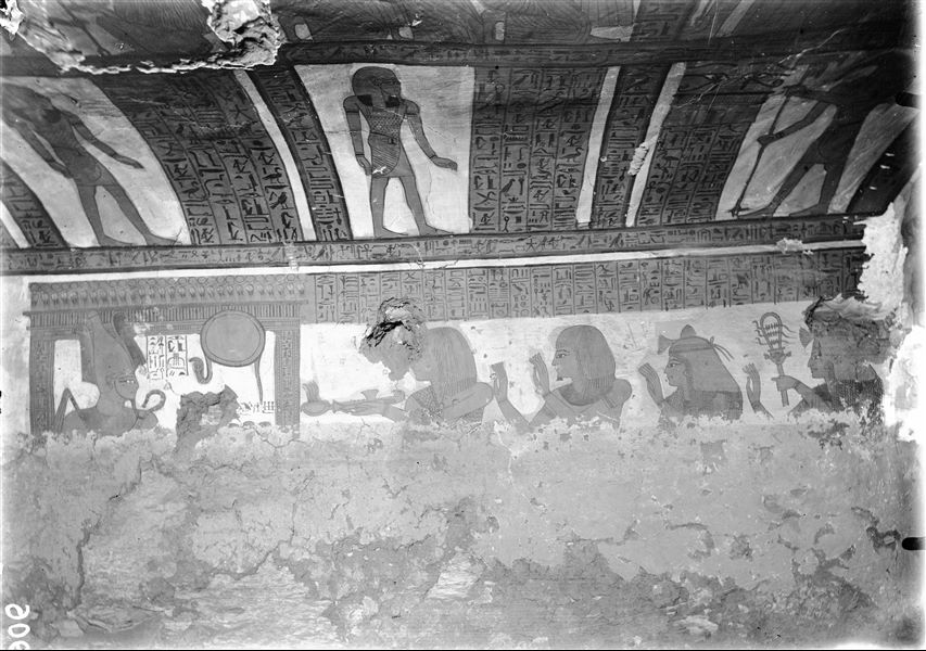 North wall, damaged, and part of the ceiling from the burial chamber of the tomb of Paneb (TT221). An adoration scene before the god Osiris inside a shrine.  