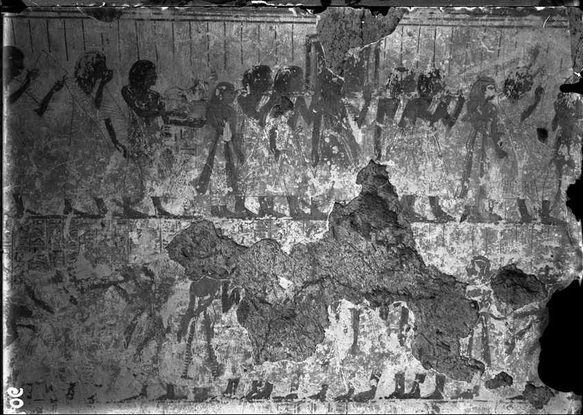 East wall of the chapel from the tomb of Amenemipet (TT 215). In the upper register, a funerary procession. The register below is less visible but also displays a funeral procession.  