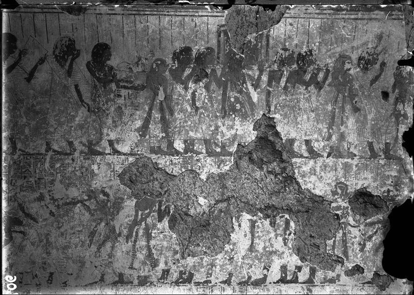 East wall of the chapel from the tomb of Amenemipet (TT215). In the upper register, a funerary procession. The register below is less visible but also displays a funeral procession.  