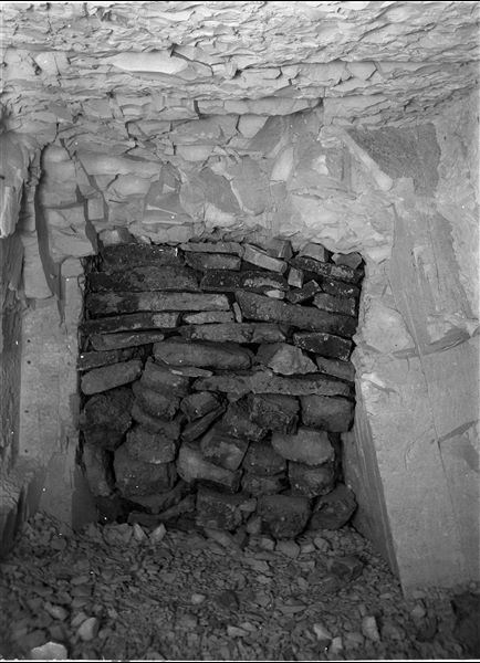 Intact tomb of Kha and Merit. The horizontal corridor leading to the burial chamber is blocked halfway by a wall. Photographed at the time of discovery. Schiaparelli excavations.