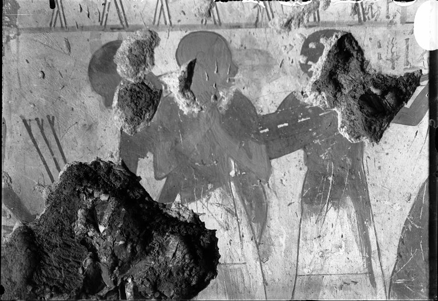 Detail from a wall scene, probably from the tomb of Horemheb (TT 78). Three people are represented, however quite damaged. 