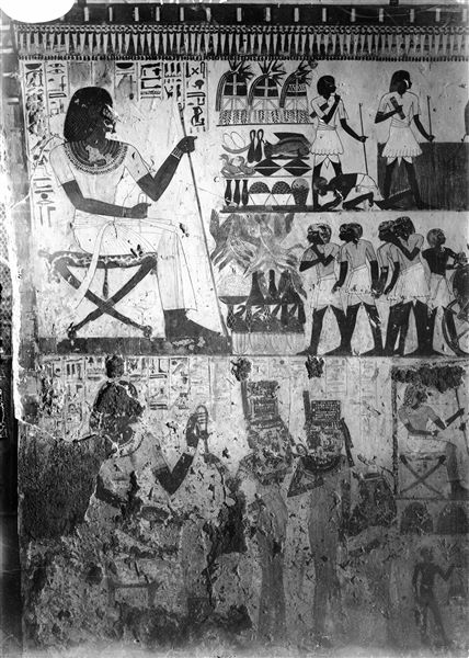 East wall, south side (left of the entrance) of the transverse chamber from the tomb of Menna (TT69). The deceased receives offerings that are piled up in front of him. 