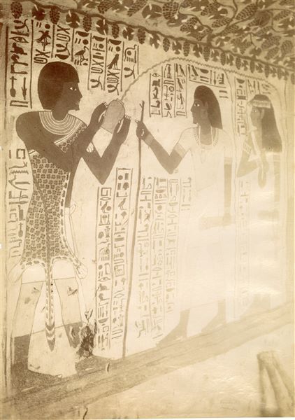 Image of the south-eastern corner from the Tomb of Sennefer (TT96).  In the scene, the deceased and his wife are purified by a Sem priest who is wearing a leopard’s skin. The photo can be attributed to Antonio Beato. 