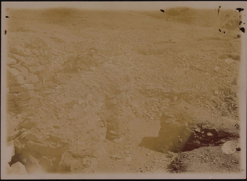 Photograph of an undistinguishable area from the Italian Archaeological Mission excavations in the Valley of the Queens. The photo is also very light, tending more towards sepia.