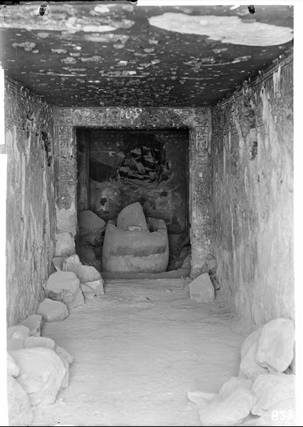 Inside the tomb of Prince Paraherwenemef (QV42) at the time of its discovery. In the middle of the burial chamber, a female pink granite sarcophagus is visible (S.5435/1 e S.5435/2). Schiaparelli excavations.