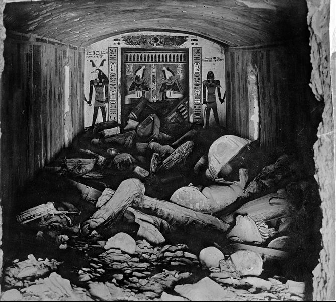 Burial chamber of the tomb of Prince Khaemwaset (QV44) at the time of its discovery on February 15th 1903. More than forty wooden sarcophagi were found from a later period (25th-26th Dynasties), when the tomb was reused. Photograph taken from the vestibule. Schiaparelli excavations.