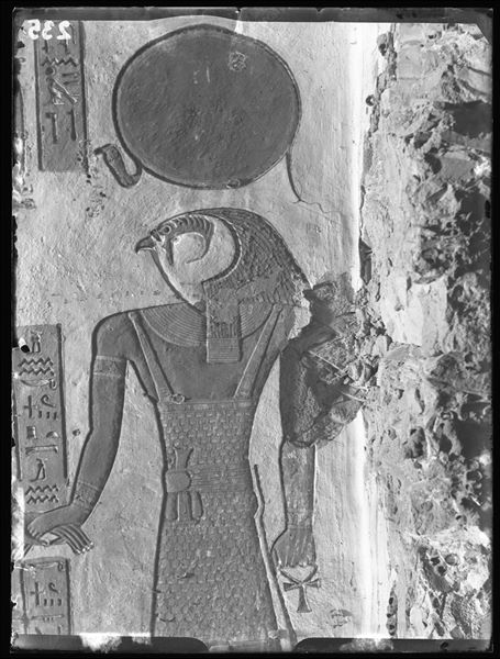 East wall of the vestibule (scene 3) from tomb QV44, depicting the god Ra-Horakhty who is holding the hand of Ramesses III (the pharaoh is not visible in this photograph). Schiaparelli excavations. 