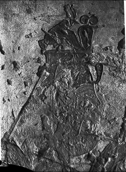 Fragmentary representation of Queen Tyti in the internal corridor of tomb QV52, worshipping the gods Imseti and Duamutef and the goddess Isis - the gods are not visible in this photograph. Schiaparelli excavations. (Original label: painted bas-relief from the tomb of Queen Tyti (previously known)).