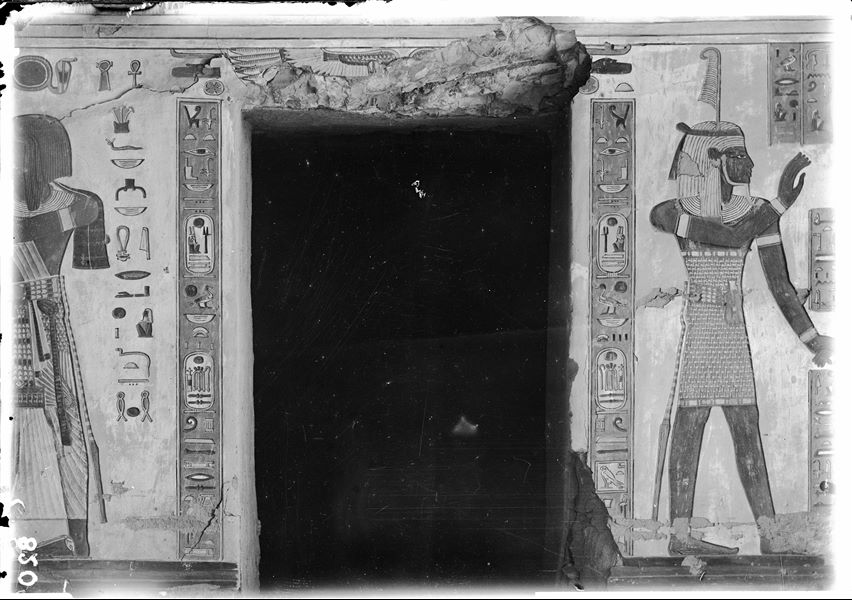 West wall (right) from the antechamber of the tomb of Amonherkhepeshef (QV55), access to the lateral annex. On the right, the god Shu is visible. To the left of the access, Pharaoh Ramesses III who holds the hand of the funerary deity Qebehsenuf (not visible in this photograph). Schiaparelli excavations.
