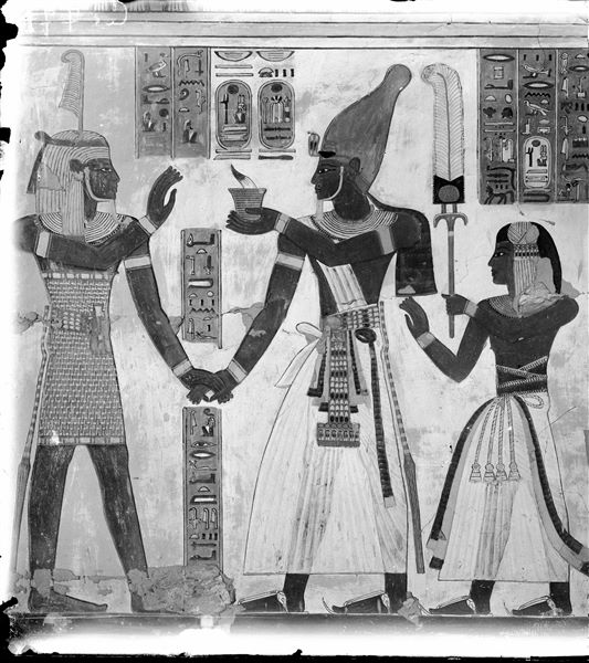 West wall (right) from the antechamber of the tomb of Amonherkhepeshef (QV55). Identifiable from the right: Prince Amonherkhepeshef followed his father Ramesses III who presents his right hand to the god Shu and holds an incense-burner in his left hand. Schiaparelli excavations. 