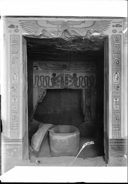 Inside the tomb of Prince Amonherkhepeshef (QV55), at the time of discovery. In the foreground, the prince's granite sarcophagus in his burial chamber. Schiaparelli excavations.