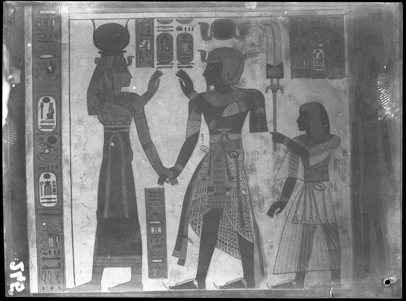 South wall (back), from the antechamber of the tomb of Amonherkhepeshef (QV55), west side (right) of the access to the burial chamber. Depicted starting from the right: the young Amonherkhepeshef, his father Pharaoh Ramesses III who holds hands with the goddess Hathor. Schiaparelli excavations.