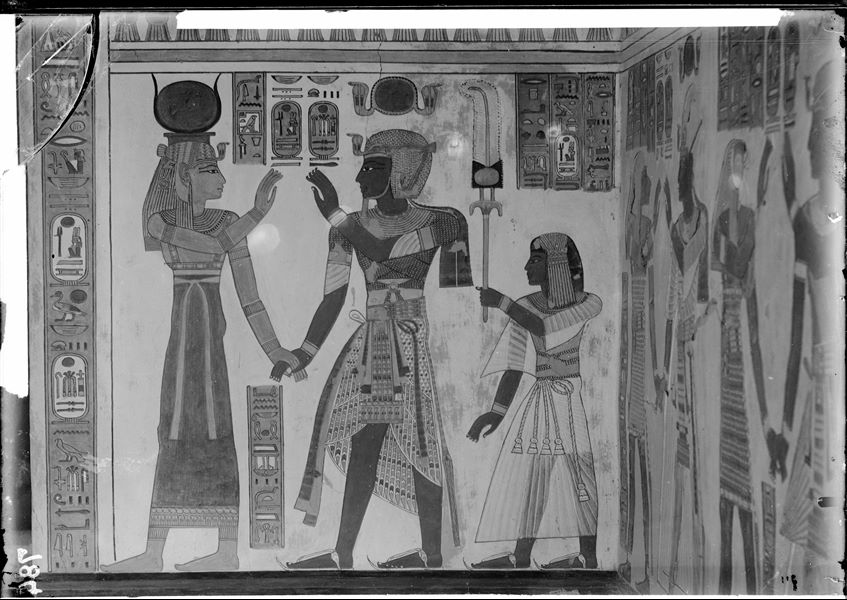 South wall (back), from the antechamber of the tomb of Amonherkhepeshef (QV55), right side. Depicted starting from the right: the young Amonherkhepeshef, his father Pharaoh Ramesses III who holds hands with the goddess Hathor. Schiaparelli excavations. 