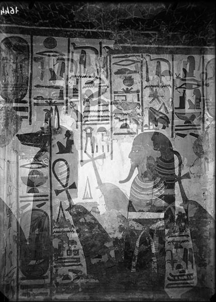 Plate used twice (the images are superimposed on each other), representing in both cases part of the south wall of the western annexe. Three figures are represented: the sons of Horus, Imseti and Duamutef and the goddess Isis - here faded,  (Duamutef and Isis must have been part of the same shot).