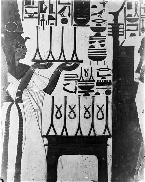 First eastern annex (alcove), west wall, north side, scene 13. Nefertari is represented in the act of making a linen offering to the god Ptah (not visible in this photograph).