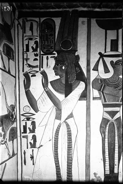First eastern annexe (alcove), west wall, south side, scene 16. Nefertari is presumably represented in the act of reciting an invocation from Spell 148 of the Book of the Dead, which is depicted on the next wall (the south wall, left, scene 17).