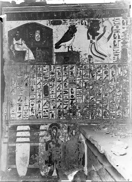 Interior of the tomb of Nefertari, antechamber, south-east wall, scene 2: the queen is depicted playing senet, her Ba is on a small temple, followed by the queen (once again) in the act of adoration. In the centre, Spell 17 of the Book of the Dead. The lower register shows a decoration composed of Djed pillars and Tit knots. The presence of debris is also visible on a shelf carved out from the rock. 