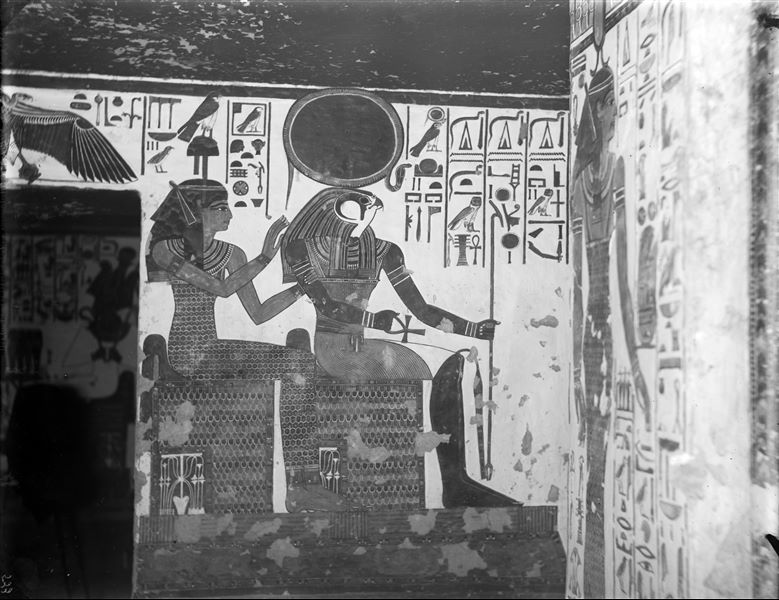 East wall of the vestibule, south side, scene 8. The gods Ra-Horakhty and Hathor are depicted seated.