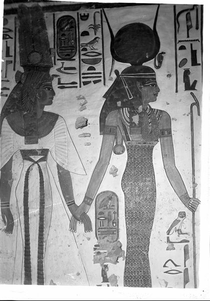 Vestibule, north wall, scene 10. The goddess Isis (on the right) accompanies Nefertari (left) towards the god Khepri; represented on the wall beside them. 