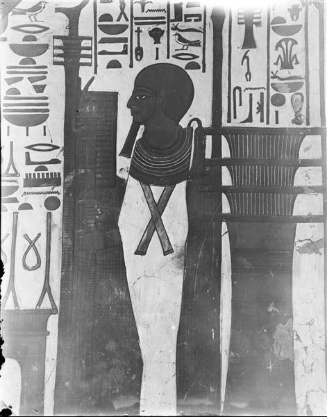 First eastern annex (alcove), west wall, north side, scene 13. The god Ptah is depicted inside a sanctuary, in the act of receiving a linen offering from Nefertari (not visible in this photograph).