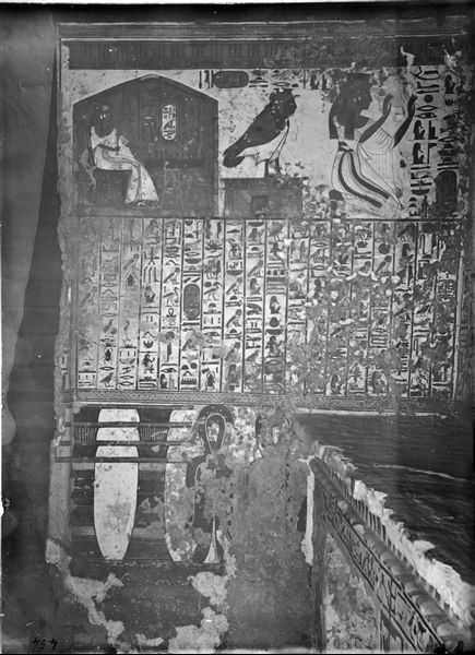 Interior of the tomb of Nefertari, antechamber, scene 2: the queen is depicted playing senet, her Ba is on a small temple, followed by the queen (once again) in the act of adoration. In the centre, Spell 17 of the Book of the Dead. The lower register shows a decoration composed of Djed pillars and Tit knots. Photographic plate in positive. 
