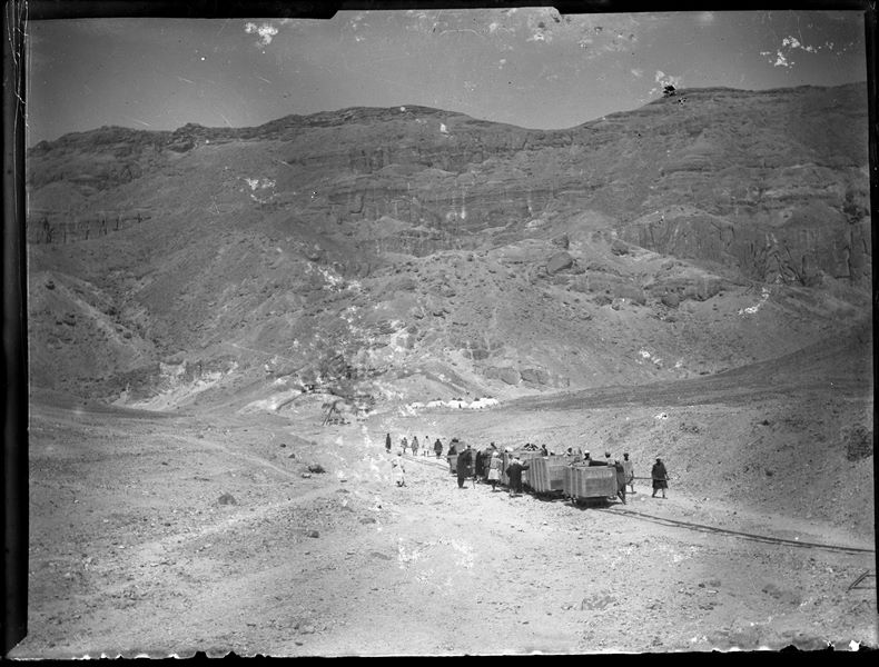  Egyptian workmen transporting crates containing antiquities via decauville rails in the Valley of the Queens, presumably in 1906, when the mission, although excavating at Deir el-Medina, still had its base camp in the Valley. That year, there were as many as nine tents. Schiaparelli excavations.