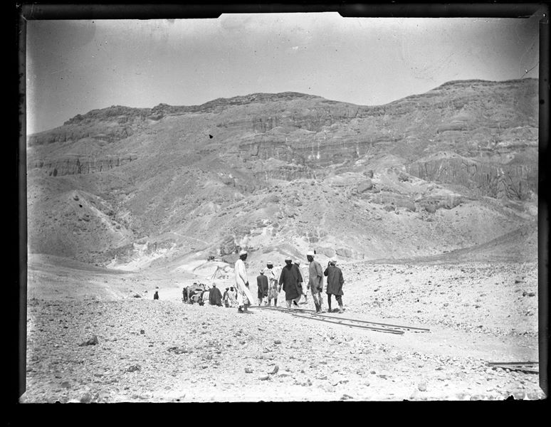 Egyptian workmen transporting crates containing antiquities via decauville rails, from the Italian Archaeological Mission’s camp in the Valley of the Queens to the Nile. Schiaparelli excavations.