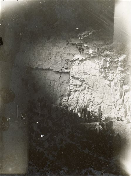 Excavations of an unfinished tomb cut into the rock. The photograph is overexposed at the bottom. Schiaparelli excavations.