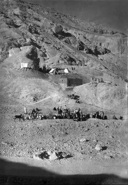 View of the Valley of the Queens. The camp of the Italian Mission is visible, while in the part below, the workers can be seen receiving their pay. Farina excavations. 