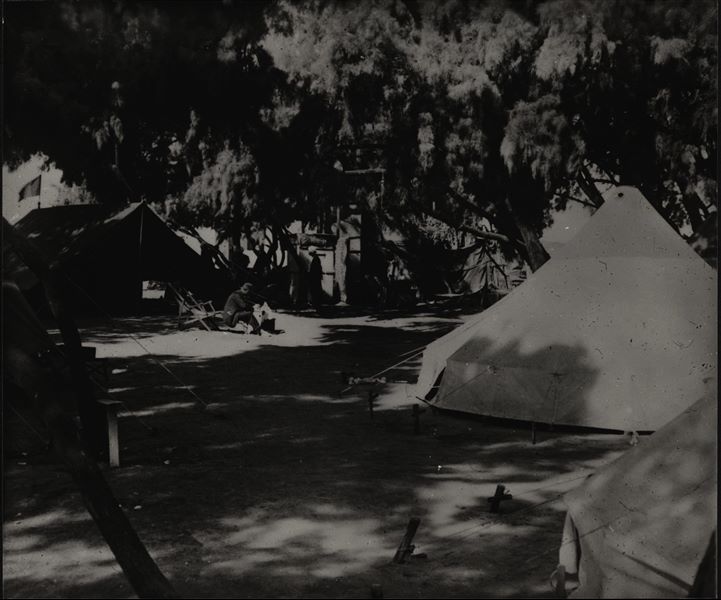 Camp of the Italian Archaeological Mission directed by Giulio Farina. The tents, unlike in the past, were set up amidst some trees away from the excavations. Giovanni Marro can be identified, seated in the centre. Farina excavations.