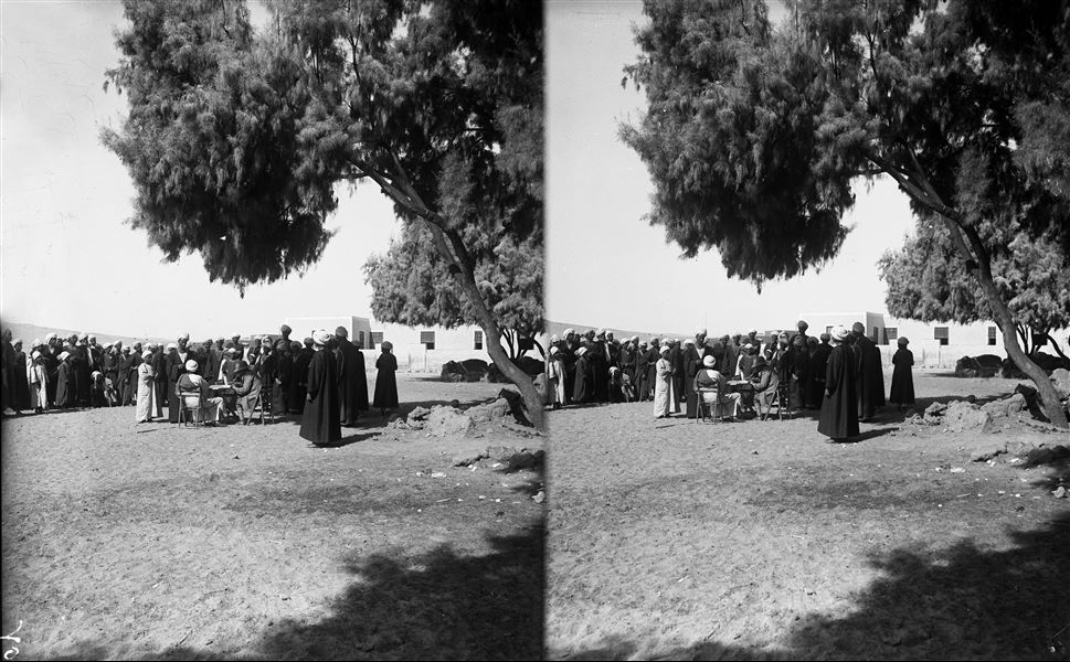 Camp of the Archaeological Mission. Visible in the centre is Giulio Farina seated at a camp table about to start the hiring process of the workers, or to distribute the weekly pay. Farina excavations. 