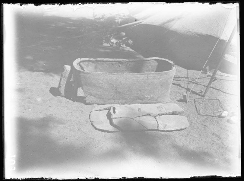 Terracotta sarcophagus with fragmentary lid, used for a burial in a contracted position. (S.15804) Schiaparelli excavations. 