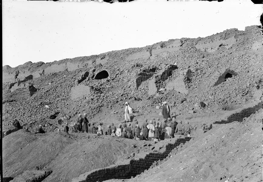 Excavations along the top of the western side of the south hill. Above is the impressive retaining wall and below is a series of barrel-vaulted warehouses. Schiaparelli excavations. 