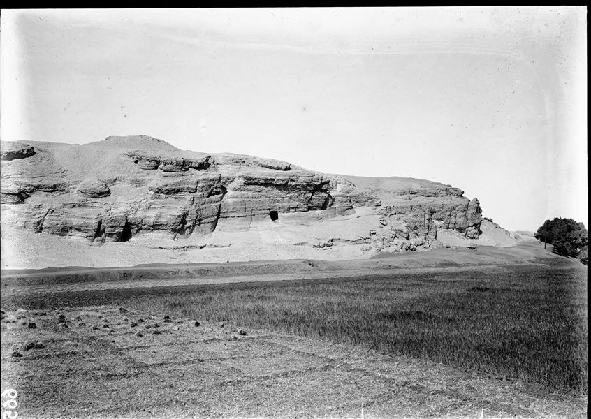 Northern end of the southern hill. The entrance to the rock-cut temple dedicated to the goddess Hathor is visible on the eastern slope. Schiaparelli or Farina excavations.