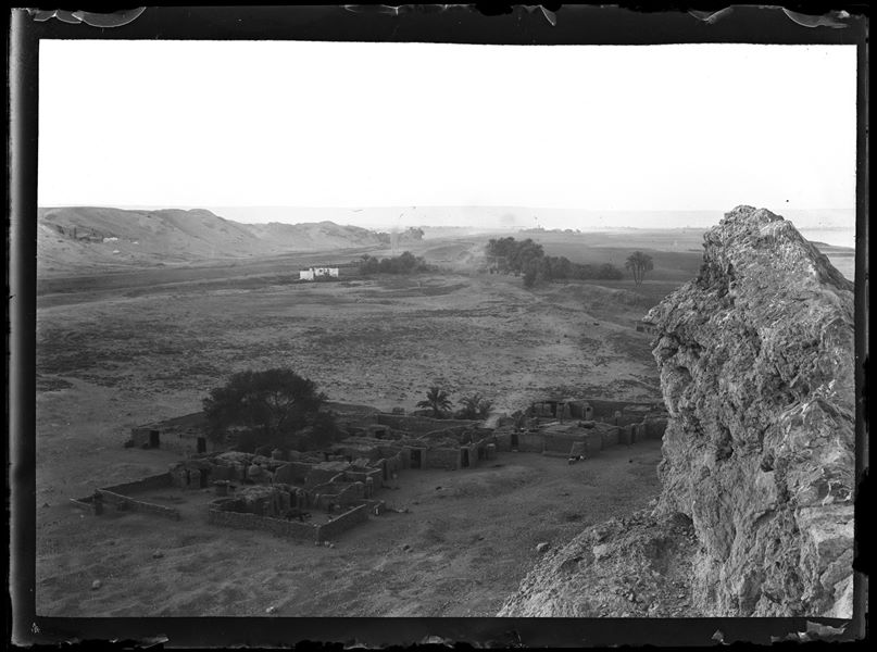  Photograph taken from the southern hill of Gebelein in the direction of the northern hill, some Egyptian dwellings can be seen on the plain. In the background, at the bottom left, the Italian Archaeological Mission’s camp can be seen on the northern hill. 