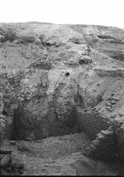 Northern necropolis. Remains of mud-brick structures bordering a room with access to a descending gallery in its centre. Some parts of the structures were dismantled to avoid a potential collapse during excavations. Schiaparelli excavations. 
