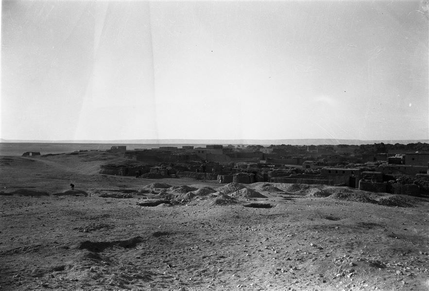 Excavation area overlooking the village of Abu Hummas. In the foreground, the entrance to a large rectangular shaft. Farina excavations. 