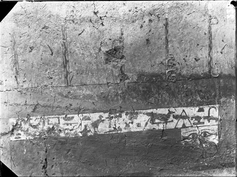 Tomb of Iti and Neferu. Detail from the left wall scene, entrance wall to the cult chapel depicting the tomb owner’s coffin. In the white band, there is an offering formula for the deceased written in hieroglyphs. A pair of painted eyes allows the deceased to see outside from within the coffin. Schiaparelli excavations.