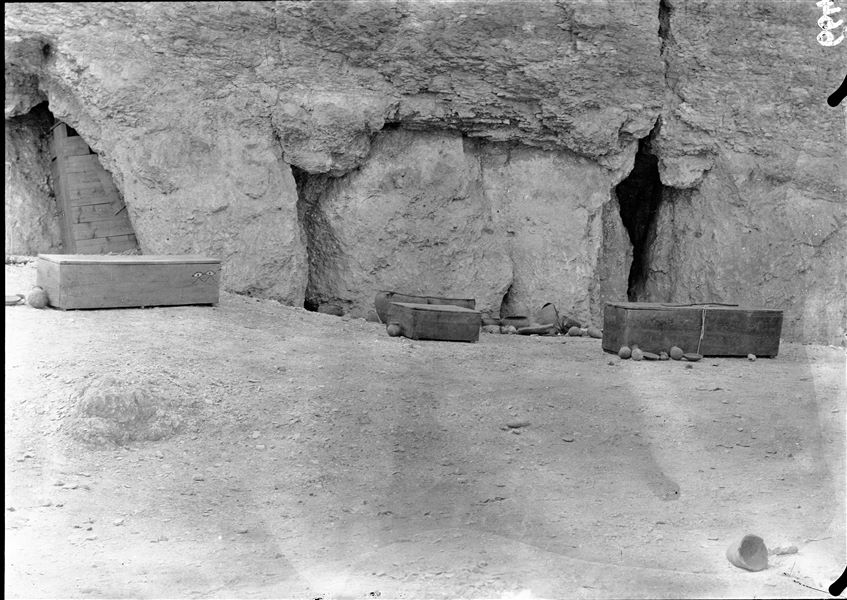 ​Inside the large natural caves. A few rectangular-shaped coffins, tall and narrow to hold the deceased who were placed on their sides. Other coffins, wider and shorter, held the deceased in a contracted position. Around the coffins, pottery vessels from the respective owners. Schiaparelli excavations.