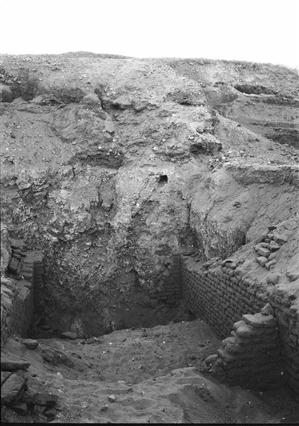 Northern necropolis. Remains of mud-brick structures bordering a room with access to a descending gallery in its centre. Some parts of the structures were dismantled to avoid a potential collapse during excavations. Schiaparelli excavations. 