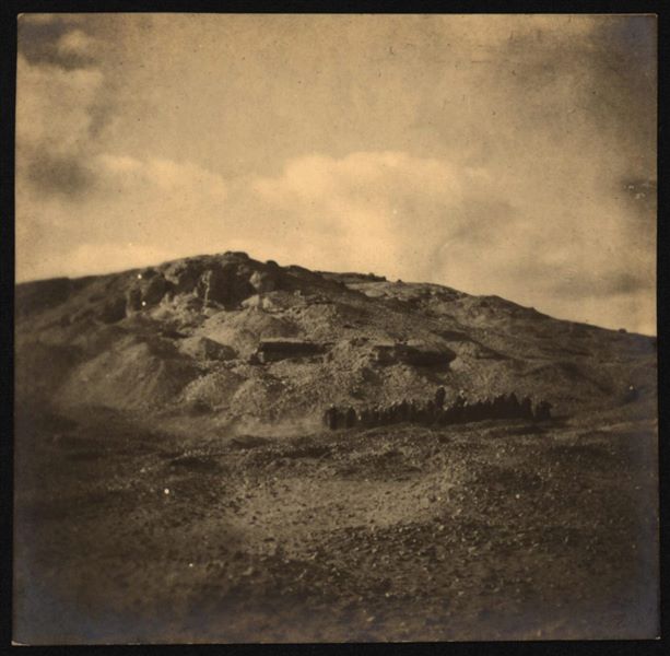 Excavations at the foot of the northern hill. In the background, the remains of ancient mud-brick walls. Schiaparelli excavations.