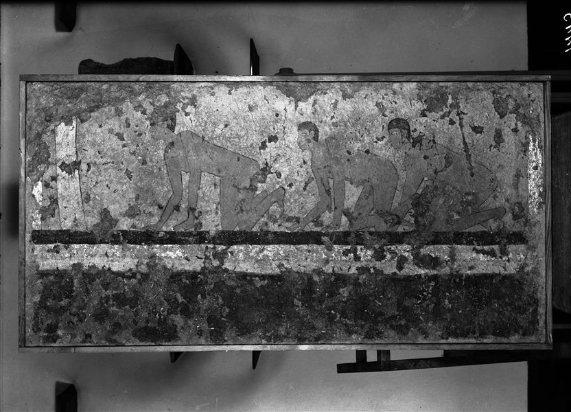 Tomb of Iti and Neferu. Museum display. Pillar number 11. Three young male figures are depicted kneeling, their nudity suggests that they are war captives. Schiaparelli excavations. (S.14354/06) 